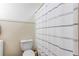 Well-lit bathroom features a white shower curtain and wainscoting at 309 Kingbird Rd, Ladson, SC 29456