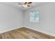 Bright bedroom with a ceiling fan and wood-look flooring at 309 Kingbird Rd, Ladson, SC 29456
