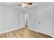 Neutrally decorated bedroom with a ceiling fan and light wood flooring at 309 Kingbird Rd, Ladson, SC 29456