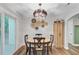 Cozy dining room with a stylish chandelier and access to outdoor space at 309 Kingbird Rd, Ladson, SC 29456