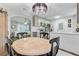 Dining area next to the kitchen with table, chairs, and stylish lighting at 309 Kingbird Rd, Ladson, SC 29456