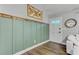 Charming entryway with wainscoting and wood-look flooring at 309 Kingbird Rd, Ladson, SC 29456