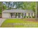 Charming single-story home with a well-maintained lawn and inviting curb appeal at 309 Kingbird Rd, Ladson, SC 29456