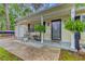 Inviting covered front porch with rocking chairs and hanging plants, creating a cozy entrance at 309 Kingbird Rd, Ladson, SC 29456