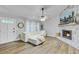 Inviting living room with a stone fireplace and ample natural light at 309 Kingbird Rd, Ladson, SC 29456