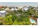 A picturesque aerial view of stunning homes, lush greenery and a glistening beach, creating a serene coastal ambiance at 3109 Ion Ave, Sullivans Island, SC 29482
