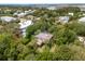 Aerial view of a charming home with solar panels and lush greenery in a tranquil, residential neighborhood at 3109 Ion Ave, Sullivans Island, SC 29482