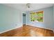 Inviting bedroom featuring hardwood floors, a ceiling fan, and a window with natural light at 3109 Ion Ave, Sullivans Island, SC 29482