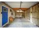Attached garage featuring a door, shelving, and utility access at 3109 Ion Ave, Sullivans Island, SC 29482