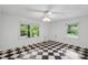 Bright room with two windows for natural light and black and white checkered floors at 3109 Ion Ave, Sullivans Island, SC 29482