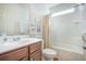 Clean bathroom features wood vanity, a shower-tub combination, and a large mirror with excellent lighting at 311 Beachgrass Ln, Summerville, SC 29486