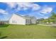 Well-maintained single-story home with lush green lawn and charming exterior at 311 Beachgrass Ln, Summerville, SC 29486