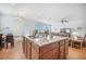 Spacious kitchen island with granite countertop, sink, and dining area offer a bright and functional heart of the home at 311 Beachgrass Ln, Summerville, SC 29486