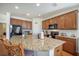 Kitchen island with sleek granite countertops, stainless steel appliances, and generous cabinet space for storage at 311 Beachgrass Ln, Summerville, SC 29486