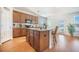 Kitchen with island, granite counters, stainless appliances, and bar stool seating for modern cooking and entertaining at 311 Beachgrass Ln, Summerville, SC 29486