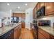 Kitchen features updated appliances, granite countertops, ample cabinet space, and functional design for daily living at 311 Beachgrass Ln, Summerville, SC 29486