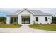 Community pool entrance with gated access, landscaped greenery, and clear signage at 311 Beachgrass Ln, Summerville, SC 29486