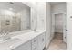 Modern bathroom features double sinks, a quartz countertop, and a separate shower room at 327 Calm Water Way, Summerville, SC 29486