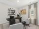 Functional home office featuring a sleek desk, ample shelving, and a comfortable seating area at 327 Calm Water Way, Summerville, SC 29486