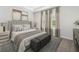 Serene main bedroom with soft lighting, elegant decor, and plush bedding creates a relaxing retreat at 327 Calm Water Way, Summerville, SC 29486