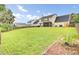 Large grassy backyard, perfect for outdoor activities and relaxation, features a patio with furniture at 327 Eagle Ridge Rd, Summerville, SC 29485