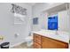 This bathroom features a window, a toilet, a sink, and a vanity at 327 Eagle Ridge Rd, Summerville, SC 29485
