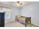 This bedroom features a ceiling fan, a window, and a twin bed at 327 Eagle Ridge Rd, Summerville, SC 29485