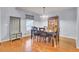 Bright dining room featuring hardwood floors, elegant lighting, and ample seating for Gathering gatherings at 327 Eagle Ridge Rd, Summerville, SC 29485