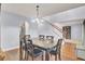 Open dining room featuring hardwood floors, elegant lighting, and easy access to living spaces at 327 Eagle Ridge Rd, Summerville, SC 29485