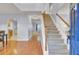 Welcoming entryway with hardwood floors, staircase, and views into adjacent living spaces at 327 Eagle Ridge Rd, Summerville, SC 29485