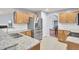 Modern kitchen with stainless steel appliances, granite countertops, and hardwood cabinets at 327 Eagle Ridge Rd, Summerville, SC 29485