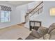 Cozy living room featuring a staircase, comfortable seating, and soft neutral tones at 327 Eagle Ridge Rd, Summerville, SC 29485