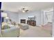 Comfortable living room featuring a fireplace, ceiling fan, and neutral tones throughout at 327 Eagle Ridge Rd, Summerville, SC 29485