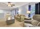 Comfortable living room featuring plush seating, ceiling fan, and natural light from the windows at 327 Eagle Ridge Rd, Summerville, SC 29485