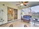 Enclosed back porch, features tiled floors, ceiling fan, and comfortable seating at 327 Eagle Ridge Rd, Summerville, SC 29485