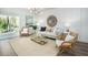 Inviting living room with neutral tones, stylish furnishings, a jute rug, and sliding glass doors for ample natural light at 333 Pine Crest View Dr Dr, Summerville, SC 29486