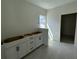 Bright bathroom featuring a window and cabinetry, ready for customization at 333 Trailmore Ln, Summerville, SC 29486