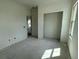 A bright bedroom featuring a window, doorway, and closet, ready for customization at 333 Trailmore Ln, Summerville, SC 29486