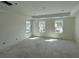 Spacious bedroom with abundant natural light from three windows and a tray ceiling, ready for personalization at 333 Trailmore Ln, Summerville, SC 29486