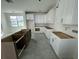 Modern kitchen featuring white cabinets and a center island with an open design at 333 Trailmore Ln, Summerville, SC 29486
