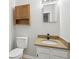 Well-lit bathroom featuring modern vanity, mirror, and toilet at 40 Elmwood Pl, Goose Creek, SC 29445