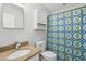 Cozy bathroom with granite vanity and patterned shower curtain at 40 Elmwood Pl, Goose Creek, SC 29445