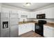 Well-appointed kitchen with stainless steel appliances, white cabinets, and modern countertops at 40 Elmwood Pl, Goose Creek, SC 29445