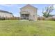 Spacious backyard featuring a screen porch and wooden fence, perfect for outdoor entertaining at 423 Watershed Dr, Goose Creek, SC 29445