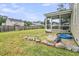 A view of the backyard from a screen porch featuring a stone rock garden and a small pool at 423 Watershed Dr, Goose Creek, SC 29445