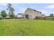 Expansive backyard with well-maintained grass and screened porch at 423 Watershed Dr, Goose Creek, SC 29445