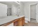 Well-lit bathroom features a shower, vanity with sink, and ceramic tile flooring at 423 Watershed Dr, Goose Creek, SC 29445