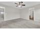 Spacious bedroom with ceiling fan and neutral carpeting offering comfort and style at 423 Watershed Dr, Goose Creek, SC 29445
