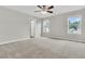 Bright bedroom with neutral walls, a ceiling fan, carpet flooring and large windows offering natural light and views at 423 Watershed Dr, Goose Creek, SC 29445