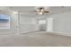 Spacious bonus room with neutral walls, ceiling fan, and natural light from the window creates a relaxing ambiance at 423 Watershed Dr, Goose Creek, SC 29445